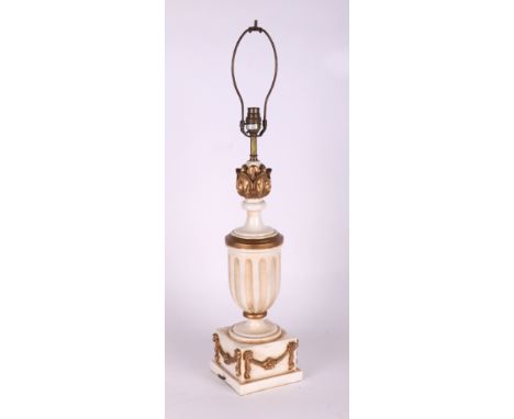 A white and gilt painted table lamp, 45cms high excluding fitment.