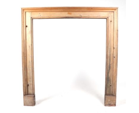 A pine fire surround with mantle shelf, 106cm wide.