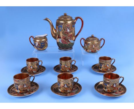 A Japanese Satsuma six-person tea service; together with a vintage Raytone hand painted tablecloth.