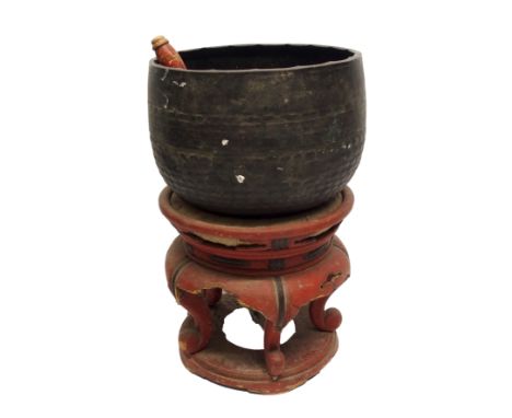 A Chinese hardwood copper drum gong on a red lacquered scroll shape base, 67cm high