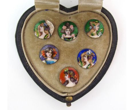 Six enamelled buttons in original case each with a portrait of a lady to centre, hair adorned with flowers, titled with name 