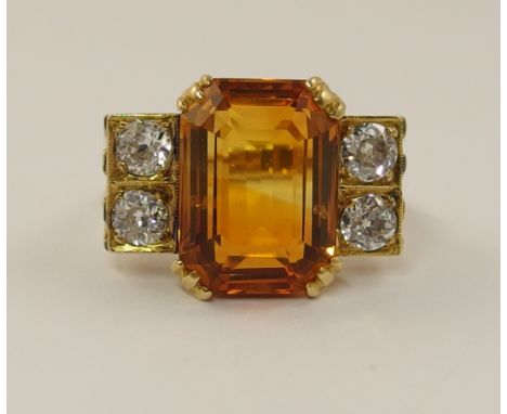 An 18ct Art Deco cocktail ring set with a bicolour citrine and four old cut diamonds to a combined approximate weight of 0.80