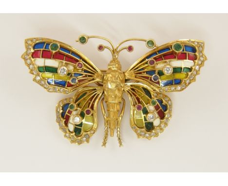 A superb example of a plique a jour enamel and gem stone brooch the wings are enamelled in vitreous enamel in blue green whit