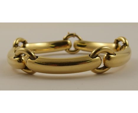 A chunky 18ct statement bracelet in a baton and ring design, hallmarked 750 possibly an early Gucci pattern. Length 20cm, wei