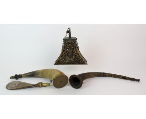 An antique wood and brass mounted powder flask the concave triangular body with various male and female figures, lion rampant