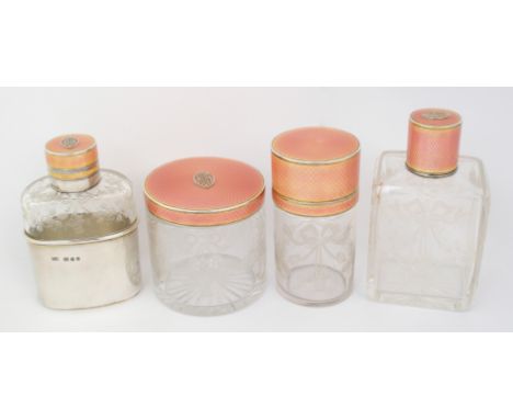 A part suite of etched glass and silver enamel topped dressing table bottles and jars by Finnigans Limited, Bond Street, Lond