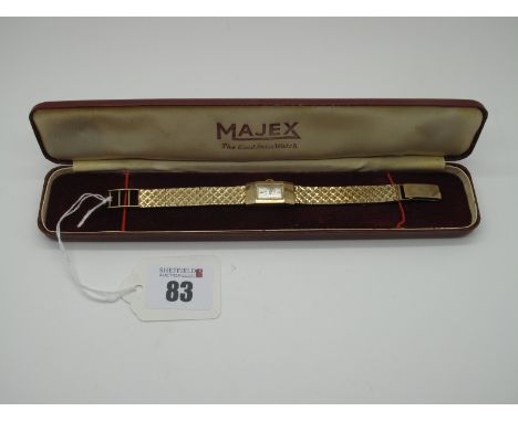 Majex; A Vintage 9ct Gold Cased Ladies Wristwatch, the signed rectangular dial with line markers, within plain case (Edinburg