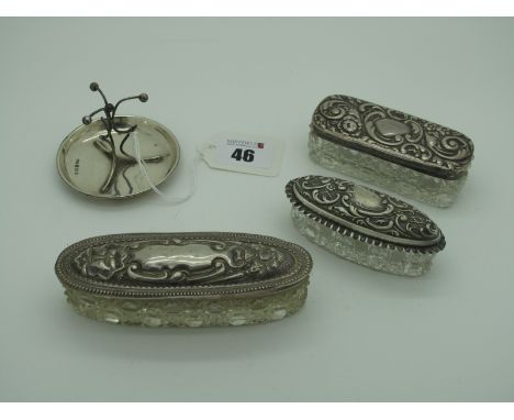 Three Hallmarked Silver Lidded Glass Trinket Boxes, (various makers/dates) (damages), longest 11cm; together with a hallmarke