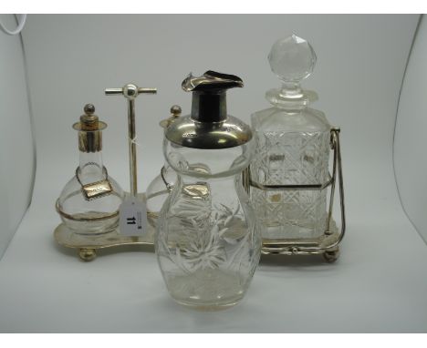 A Hallmarked Silver Mounted Glass Decanter, Sheffield 1904, "To W.D. from W.I. and H.W.B. Dec. 1904." (lacking stopper); toge