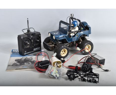 AN UNBOXED CONSTRUCTED TAMIYA RADIO CONTROL 'WILD WILLY' WILLYS M38 JEEP STUNT VEHICLE MODEL, 1/10 scale, not tested, missing
