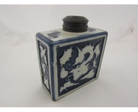 A 19th Century Chinese blue and white dragon relief tea caddy, 13cm tall