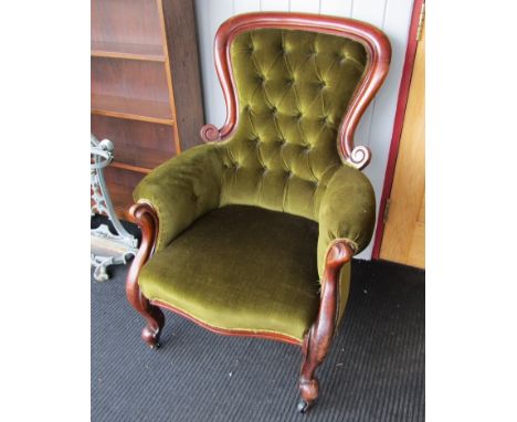A Victorian mahogany spoon/button back open armchair in dark citrine upholstery, scroll arms, modern castors, 102cm high