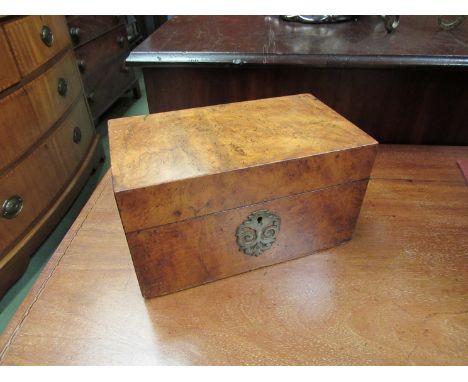 A walnut tea caddy with twin lidded compartments, brass escutcheons, 22cm wide x 12cm tall x 12cm deep