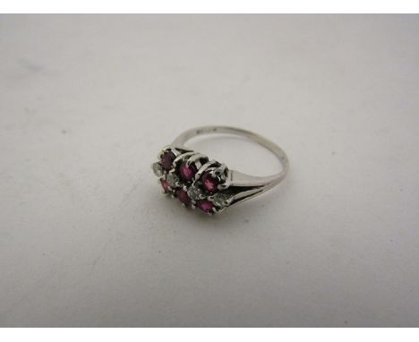 A 9ct white gold ruby and diamond ring. Size K, 2.6g