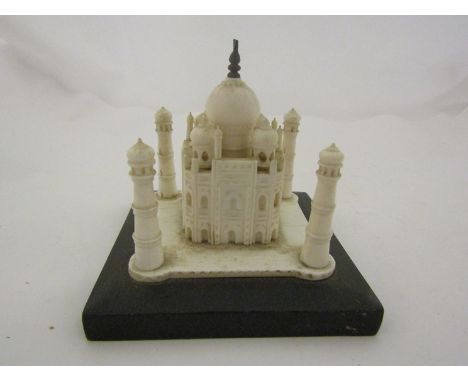 A 19th Century carved bone model of Taj Mahal on wooden ebonised base