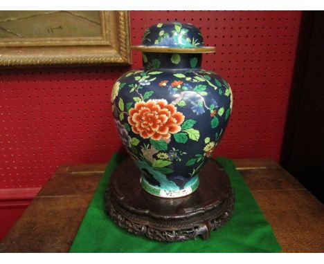 A Staffs England ceramic ginger jar drilled to be a light fitting and an Oriental wooden stand