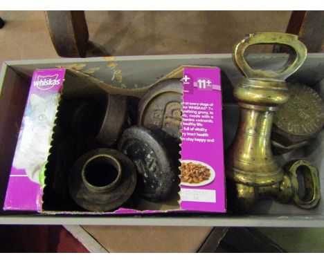 A quantity of weights and vintage pipe/valve tops