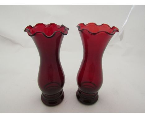 A pair of Anchor Hocking ruffle top ruby red coloured glass vases, maker's mark to base (2)