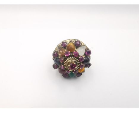 A 14 carat rose gold multi gemstone Harem Thai princess ring. Set with seventeen round mixed cut rubies with a combined appro