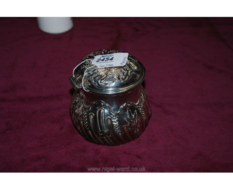 A heavily embossed Silver Tea Caddy, decorated with foliage, 1768/69, maker BG