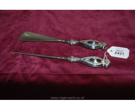An early 20th C steel Shoehorn and button Hook with silver matching handles, Birmingham 1913 maker C&amp;N