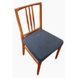 Gordon Russell teak dining table on tapering legs, with ten railback chairs, (six with leather