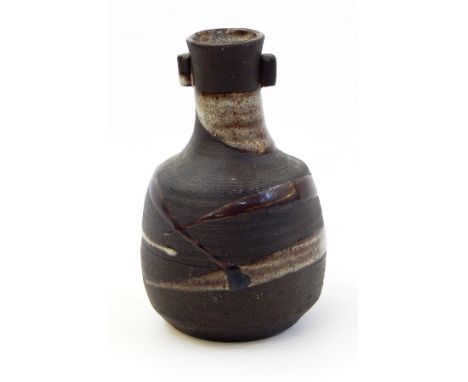 Janet Leach (1918-1997) Leach pottery stoneware vase with lug handles to the neck, brown running glaze decorated on an iron g