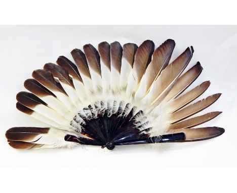 Eagle wing fan with tortoiseshell guard and sticks Live Bidding: Ribbon detached between first and second stick. Some slight 