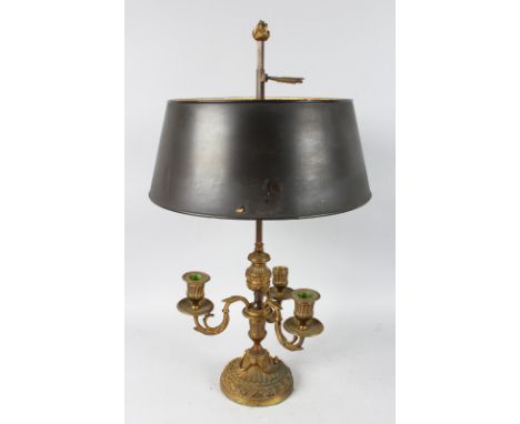 A GOOD 19th CENTURY STUDENT LAMP with Toleware shade and three scrolling branches on a circular base. 2ft high.