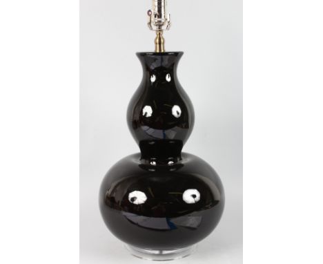 A LARGE 1970'S PORCELAIN BULBOUS LAMP, 19ins high, on a glass base converted to electricity.