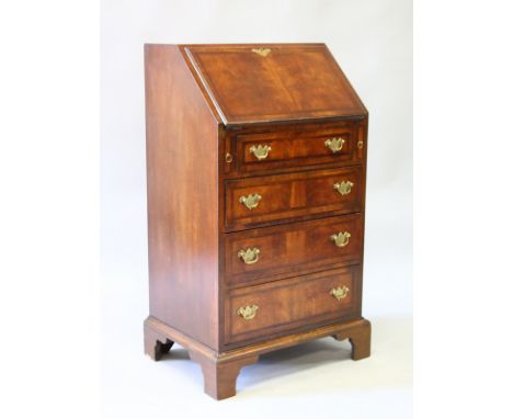 A GOOD  SMALL WALNUT BUREAU, with fall front and fitted interior, over four long graduated drawers with brass handles and sup