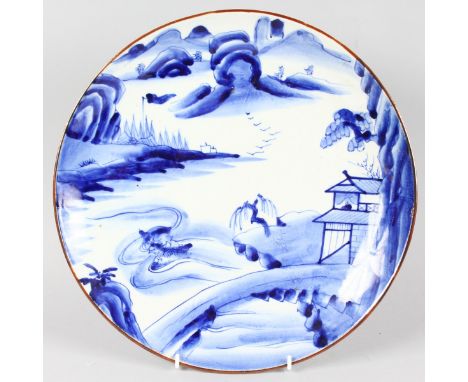 A JAPANESE BLUE AND WHITE CIRCULAR CHARGER, after a Worcester design.  13ins diameter.