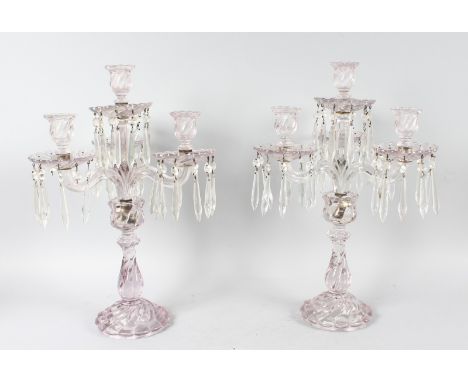 A GOOD PAIR OF 19th CENTURY CRYSTAL FOUR LIGHT CANDELABRA, with three scrolling branches on a stepped circular base. 19ins hi