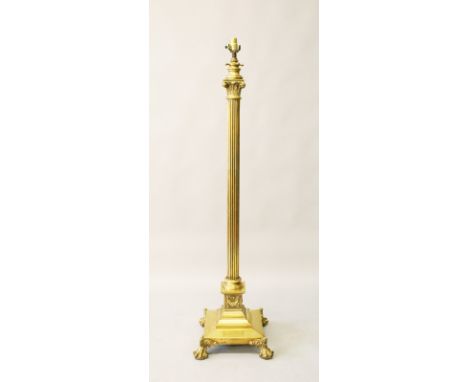 A GOOD CORINTHIAN COLUMN BRASS STANDARD LAMP on square base with claw feet. 4ft 7ins high.