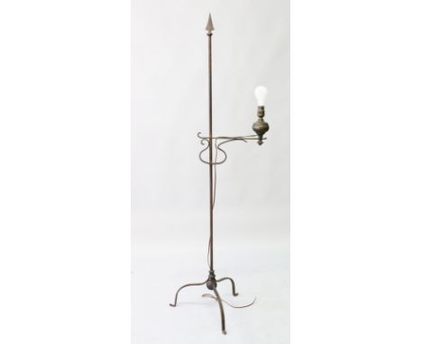 A WROUGHT IRON STANDARD LAMP on a tripod base. 5ft 4ins high.