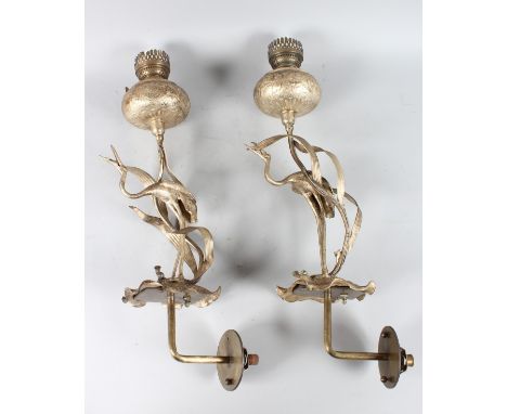 A PAIR OF 19th CENTURY PLATED OIL LAMP converted to electricity, storks on lotus leaves.