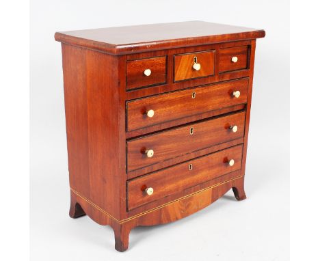 AN APPRENTICES 19TH CENTURY MAHOGANY STRAIGHT FRONT CHEST of three small and three long graduated drawers with ivory handles 