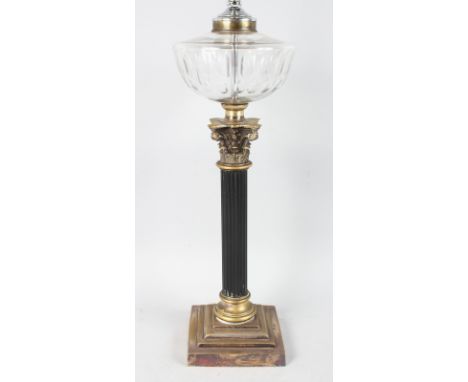 A 19th CENTURY CORINTHIAN COLUMN OIL LAMP on a stepped base.