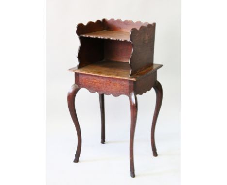AN 18th CENTURY FRENCH PROVINCIAL OAK BEDSIDE CUPBOARD with shelf on cabriole legs and waved apron. 1ft 5ins wide, 2ft 9ins h