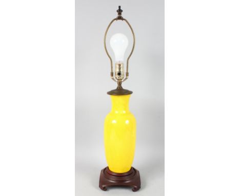 A YELLOW POTTERY LAMP converted to electricity.
