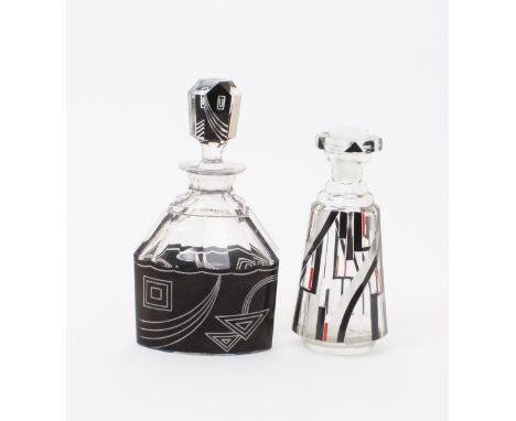 An enamelled glass decanter and stopper, tapering, faceted form enamelled with geometric panels in black, red and silver, and