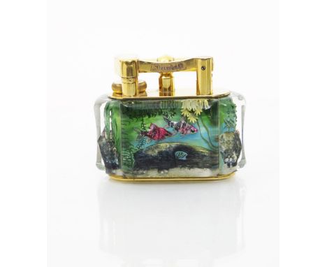 A Dunhill Aquarium table lighter by Margaret Bennett, the perspex panels reverse painted with exotic and tropical fish, with 