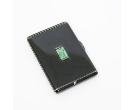 An Art Deco enamelled silver cigarette case, hinged, rectangular form enamelled black, the front set with small apple green j