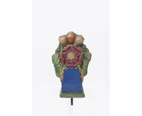 Rose a Doulton Lambeth stoneware washing-line post finial designed by Gilbert Bayes, modelled in relief on rectangular plinth