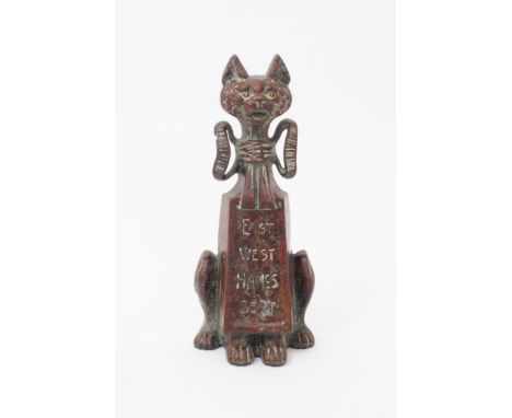 'East West Hames Best' a patinated metal door stop cast in the manner of Louis Wain, unsigned 30cm. high