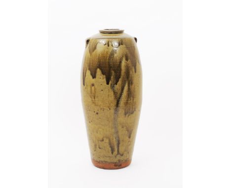 Phil Rogers (born 1951) a tall stoneware vase with applied strap handles, incised with combed decoration, covered to the foot