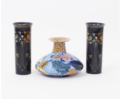 A Bursley Ware vase designed by Charlotte Rhead, pattern 1432, painted with peonies in colours, and a pair of Wood & Sons Ori