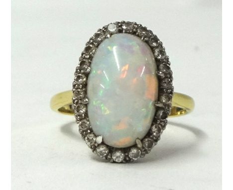 An 18ct opal cluster ring, size T.