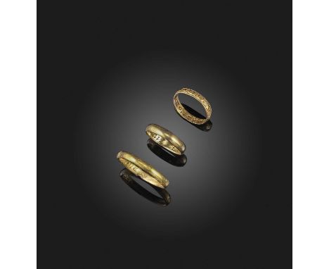 A collection of three gold posy rings, 17th and 18th centuries, comprising: a plain gold band, the interior reading 'rather d