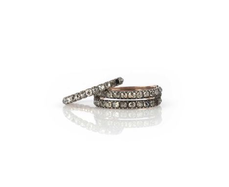 Two George III diamond rings, early 19th century, comprising: a rare full eternity ring, set with cushion-shaped diamonds in 